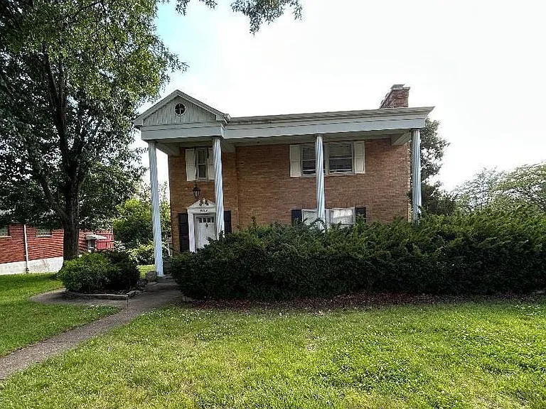 This first floor apartment is like living in a house, large front porch, yard space, driveway parking and more!