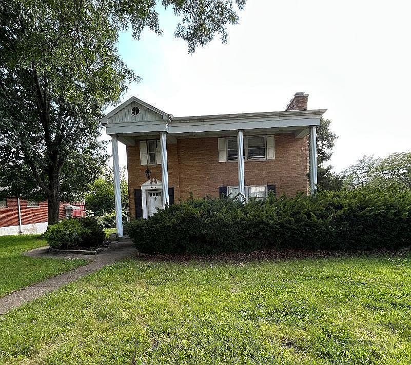 This first floor apartment is like living in a house, large front porch, yard space, driveway parking and more!