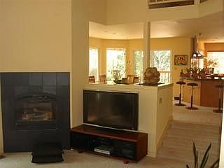 Living room, looking into dining area and remodeled kitchen.
