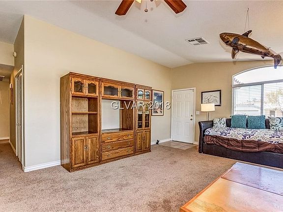 Living room with ceiling fan...