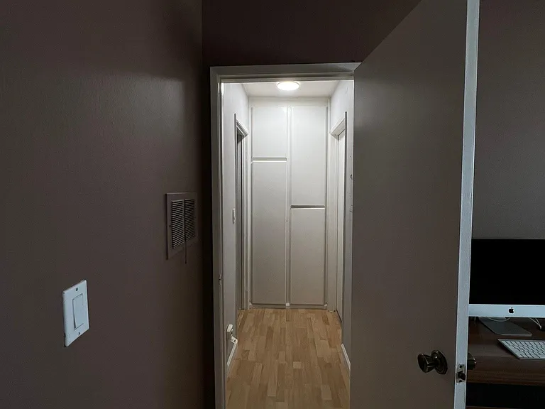 Please note: Pre-renovation photo shown for layout reference. Brand-new flooring has since been installed.
