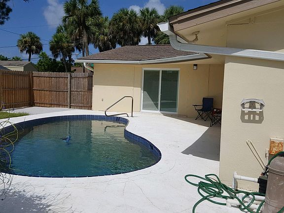 Pool and patio leading to family room.