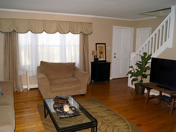 Living room with large double pane windows.