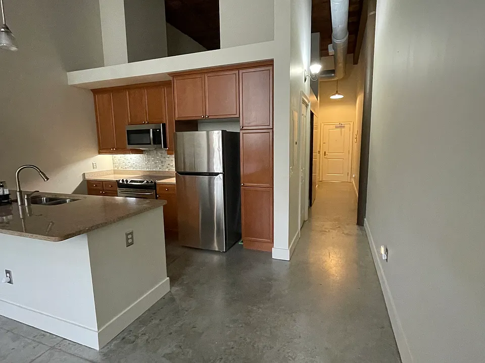 Open floor plan kitchen/living area.