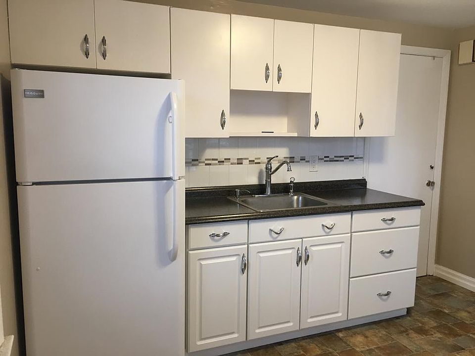 Renovated kitchen with tile backsplash