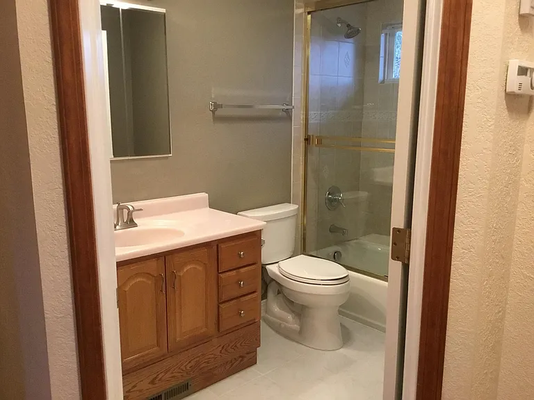 Primary bathroom with tub and enclosed shower