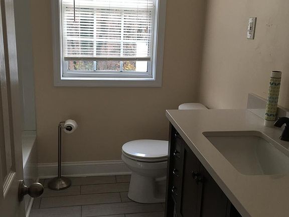 Tile floor in bathroom and plenty of storage