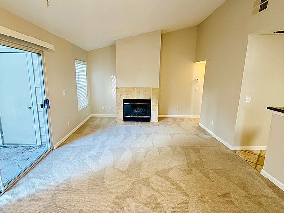 Living room with vaulted ceilings.