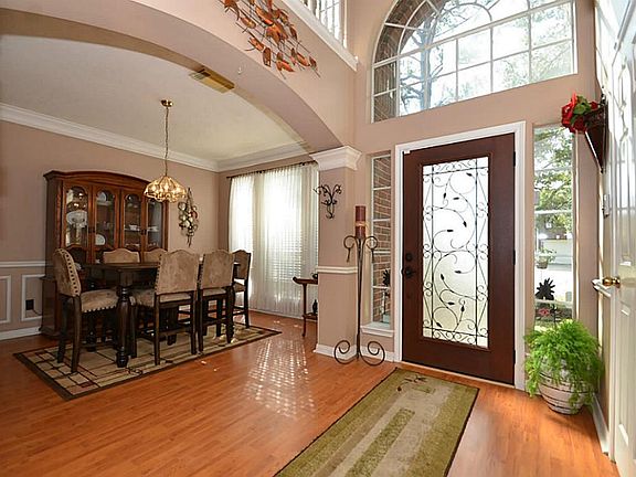 Inside, an inviting Foyer filled with natural light welcomes you.