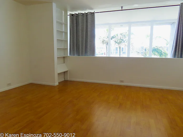 Bdrm with shelves and curtains