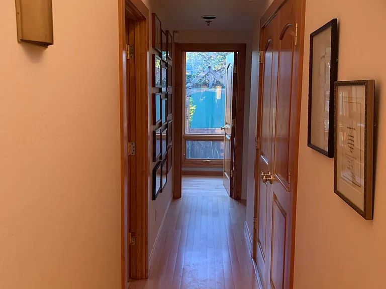 Hallway to 3 bedrooms and bathroom