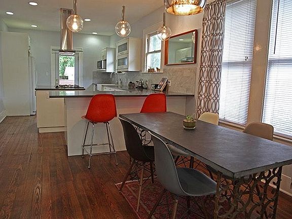 Dining area flows into renovated kitchen