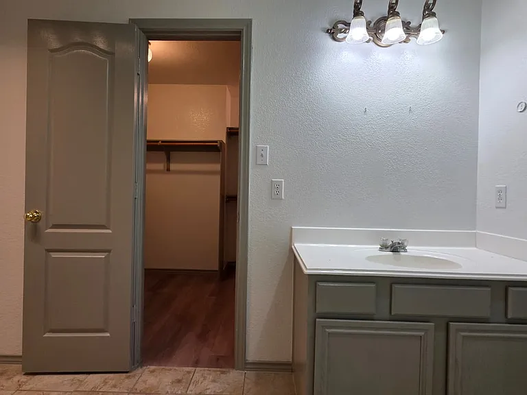 master bathroom view into closet