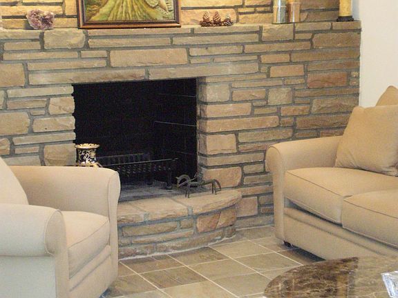 Main Level Den has access to front and back yards, garage, & TONS of light!