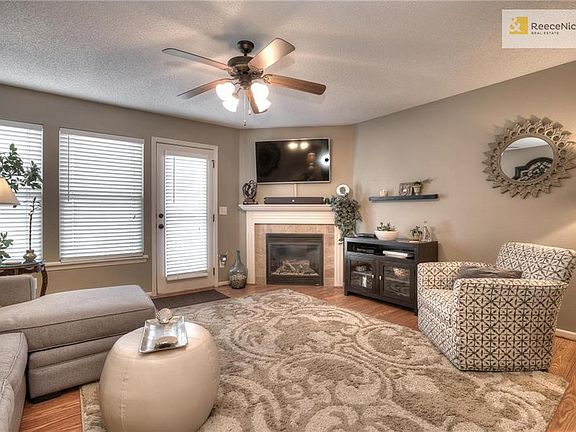 Great room with laminate wood flooring and fireplace