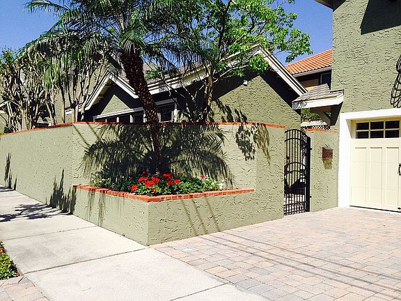 gate to pool, garage on left
