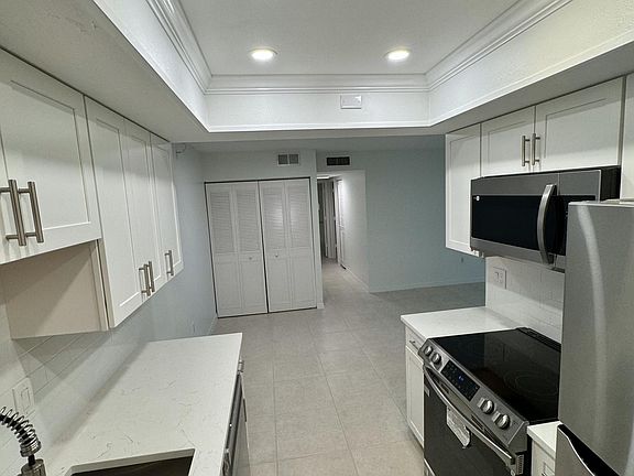 New white shaker cabinets, new Quartz countertops, and Samsung appliances