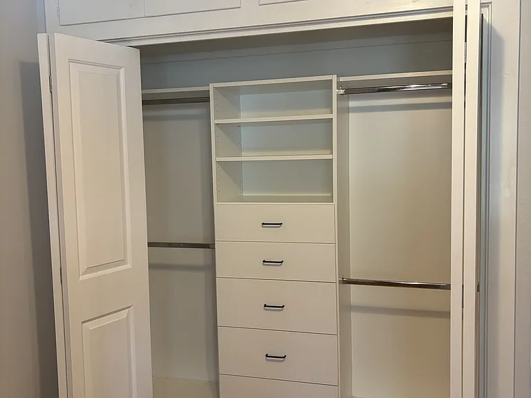 2nd bedroom closet - newly installed closet system to maximize storage