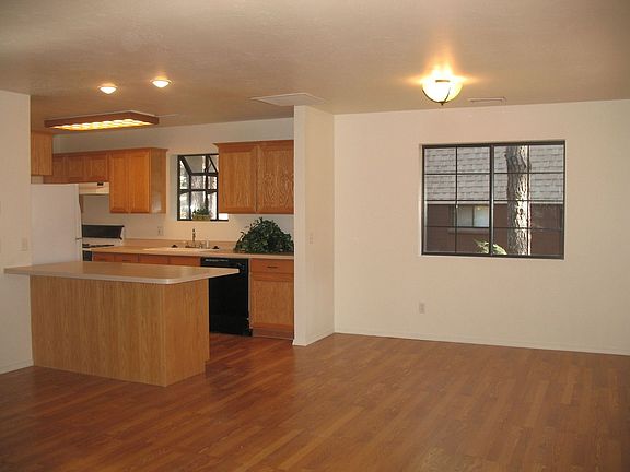 Beautiful wood laminate flooring and new carpet throughout. 