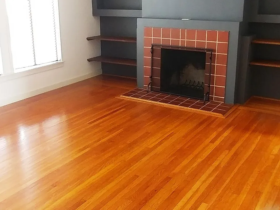 living room - in front of building. Large, good looking, sunny, spacious. Fireplace is not functional.