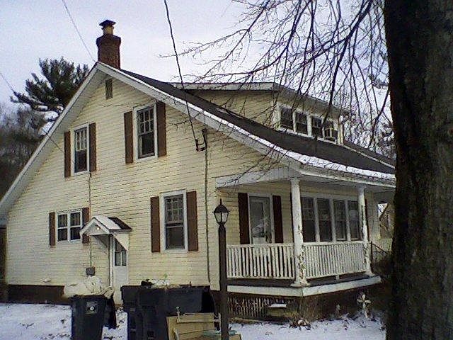 Apt is behind this house