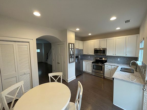 Another view of the kitchen and dining room