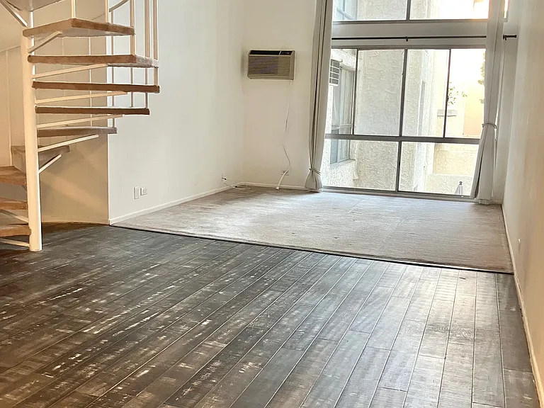 Currently throughout the downstairs new flooring & baseboards are being installed, removing carpet and updating spiral staircase.