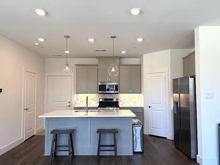 The open kitchen flows into the living area, keeping everyone connected.