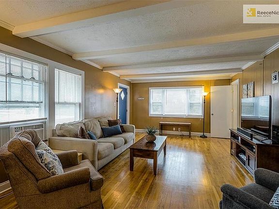 Hardwood floors and trimmed craftsman-style