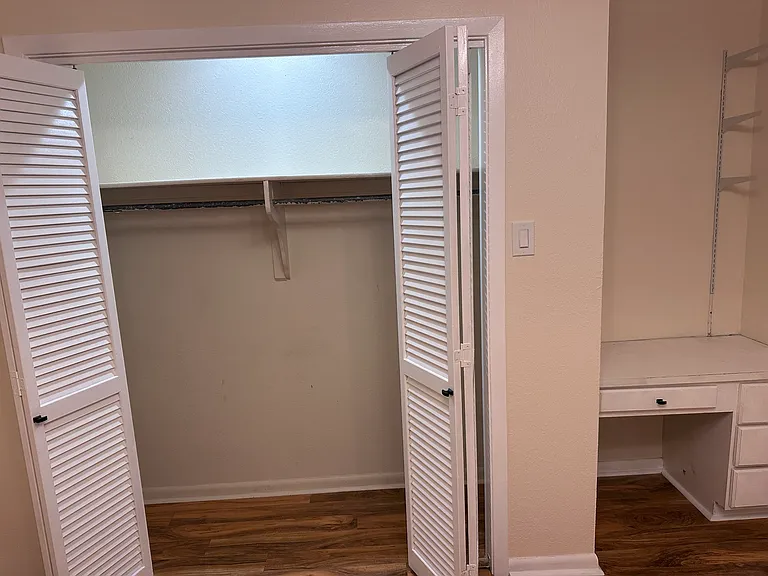 3rd bedroom with desk and closet