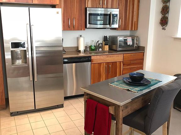 Kitchen with stainless steel appliances and island