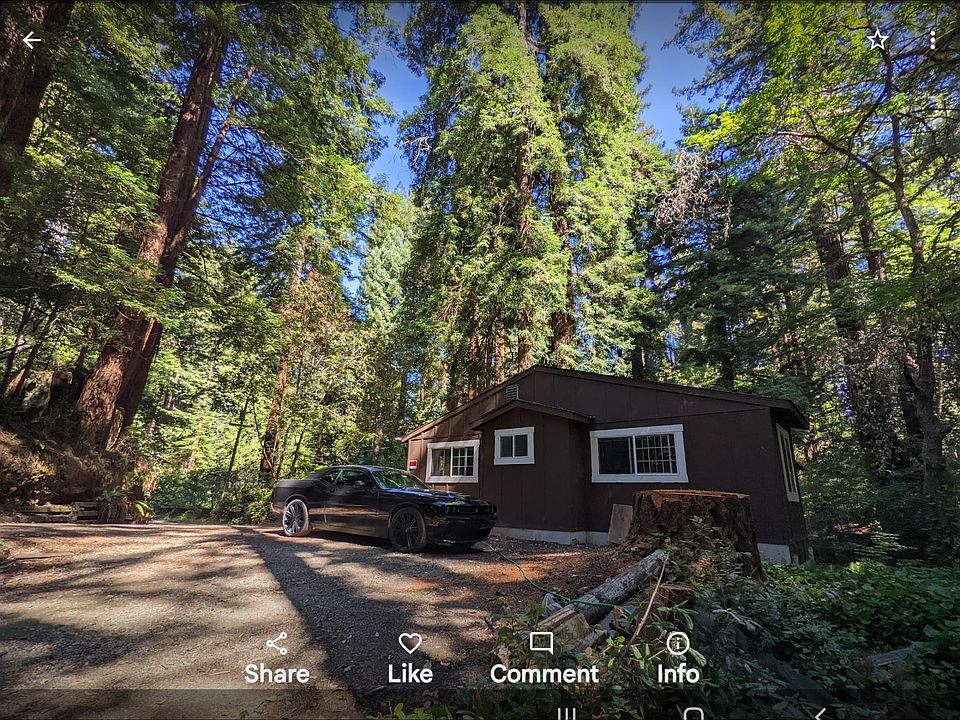 Picture across parking area to bedroom side of house.