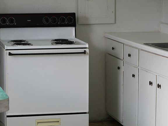 Furnished electric stove nice cabinet tops