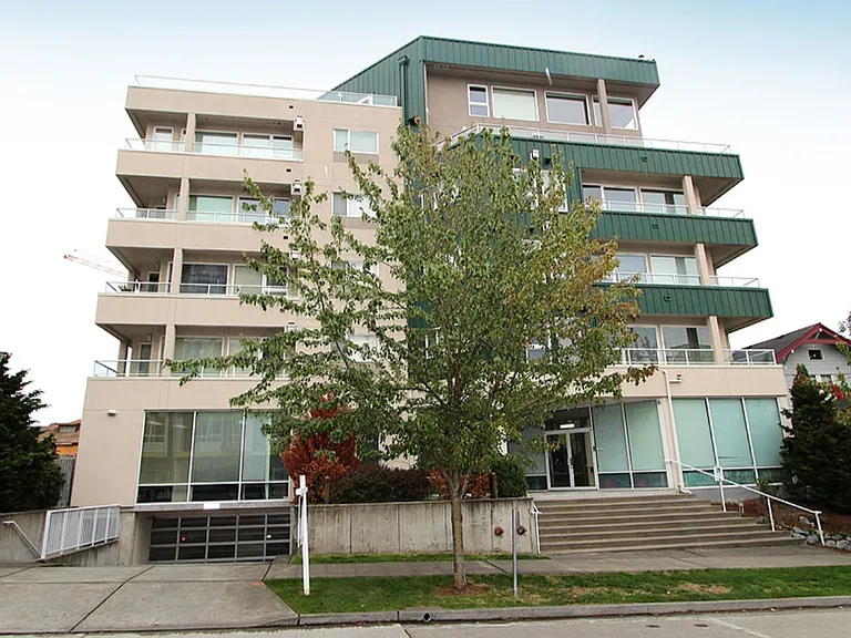 Back of building (9th Avenue) with secured garage