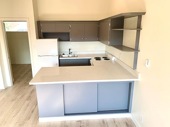 Extra wide kitchen counter functions as extra work space or bar/eating area