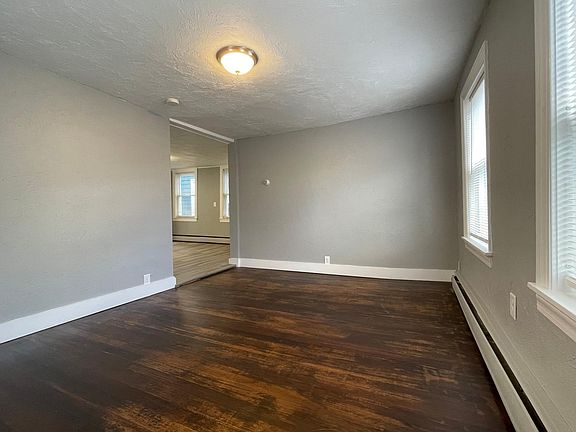 Living Room with Refinished Floors Lots of Natural Light (Front of House)