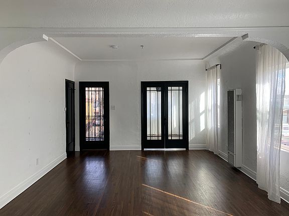 Door on left left is closet, door 2nd left is patio, double doors lead to bonus room.