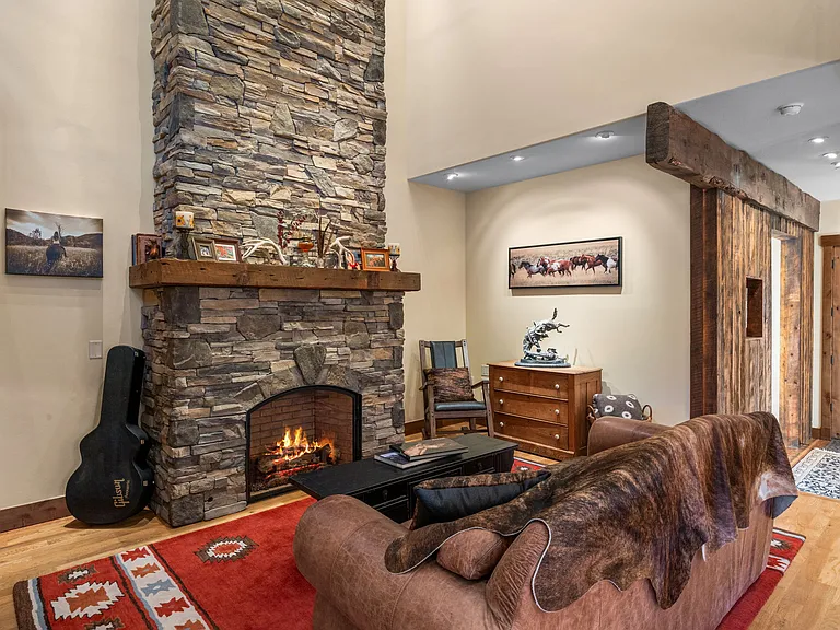 Living area with cozy gas fireplace.