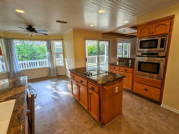 Kitchen with new electric cooktop.
