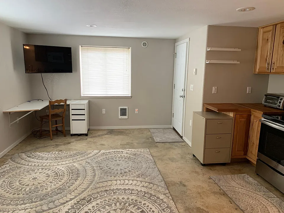 Living area and entry door. Lots of natural light