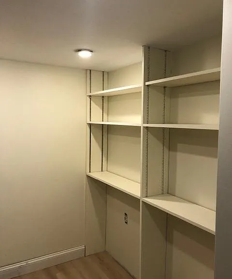 Large Pantry Area With Plenty Of Shelving And Storage Space For Your Kitchen Gadgets!
