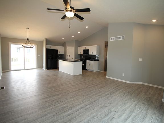 Image shows upgraded painted trim cabinets, and upgraded flooring