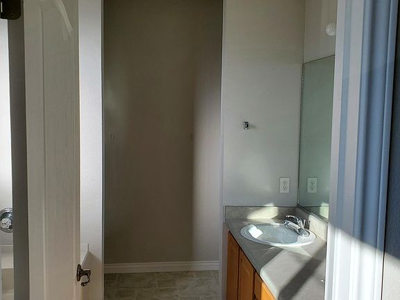 Master Bathroom with his/her sinks, separate bathtub, and standup shower.