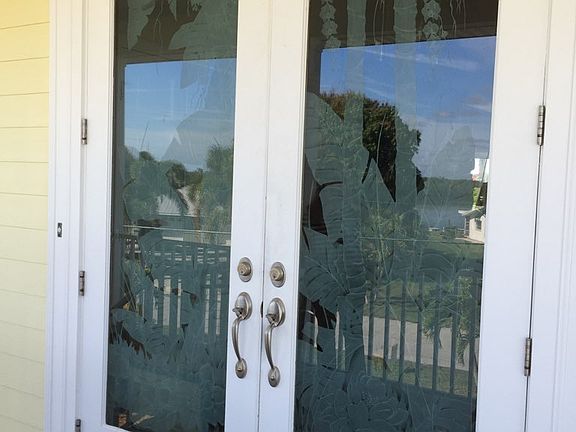 Carved glass front doors