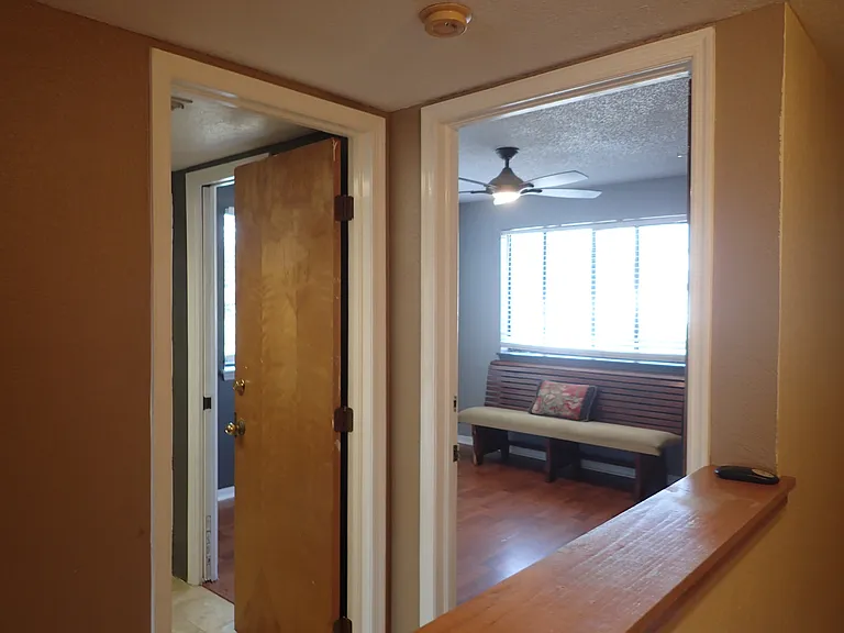 older pick both bathroom and bedroom brown doors CHANGED out to white 6 panel