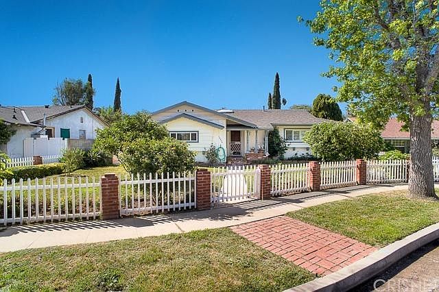The handsome curb appeal in north facing with brick accents, dual pane windows, composition roof, an