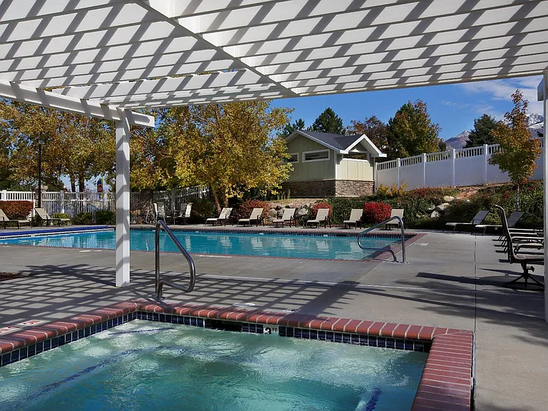 Liberty Hill Apartments, Draper, Utah, pool under a white canopy with trees in the background.