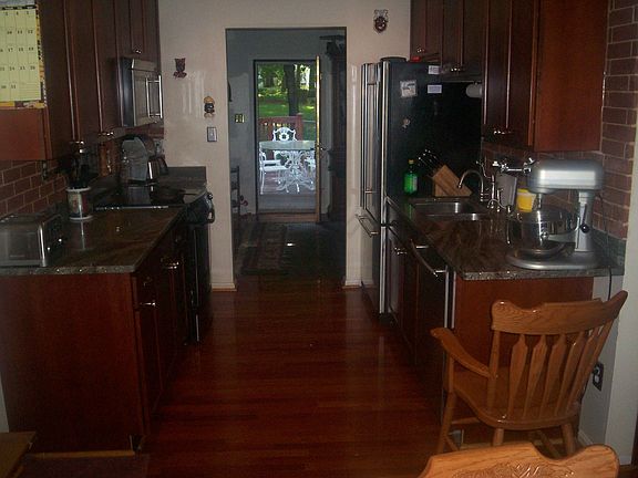 Gourmet Kitchen with granite counters, stainelss appliances, and masonary work