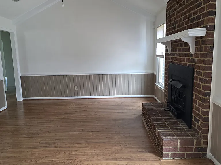 Den with working fireplace