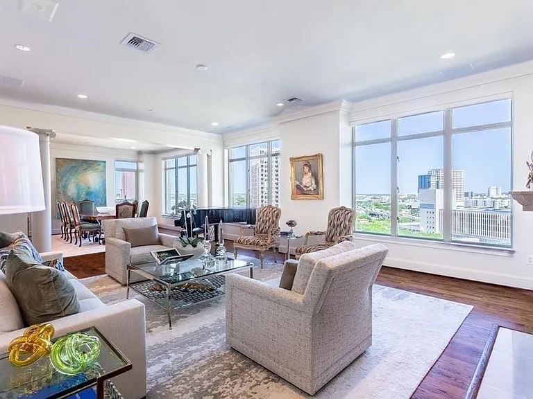 Gracious Living Room has hardwood floors, 10' ceilings, operable windows & an expansive view.
